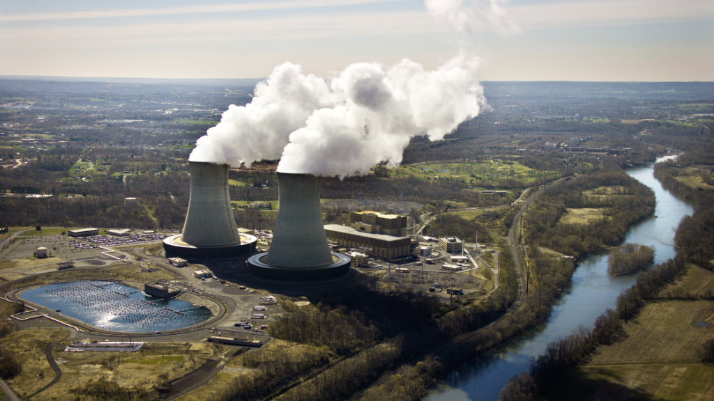 Illustration of a nuclear reactor with power lines connected to an external grid. The image represents Scope 2 emissions, where the electricity powering the reactor is sourced from fossil fuels, indirectly causing greenhouse gas emissions. The focus is on the connection between the reactor and the fossil fuel-powered energy grid.